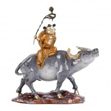 Color copper shepherd boy riding a bull